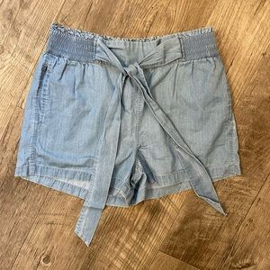 UpWest. Light Blue Chambray Paper Bag Shorts. Elastic Waist, Tie Front. Size M.